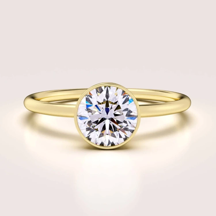 verlobungsring-bezel-mini-moissanit-0-3ct-brillantschliff-vergoldetes-silber-hariets.jpg