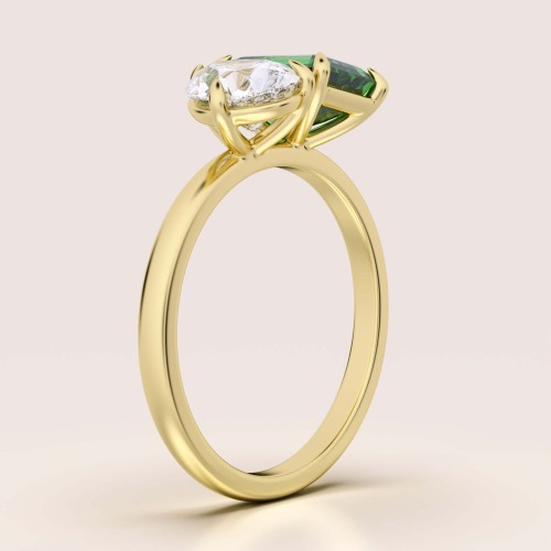 verlobungsring-toi-et-moi-hydrothermaler-smaragd-3-5ct-emeraldschliff-birnschliff-seite-gelbgold-gemini-hariets.jpg