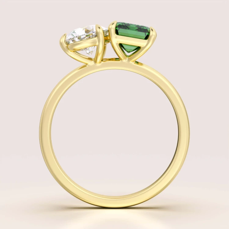 verlobungsring-toi-et-moi-hydrothermaler-smaragd-3-5ct-emeraldschliff-birnschliff-frontansicht-gelbgold-gemini-hariets.jpg