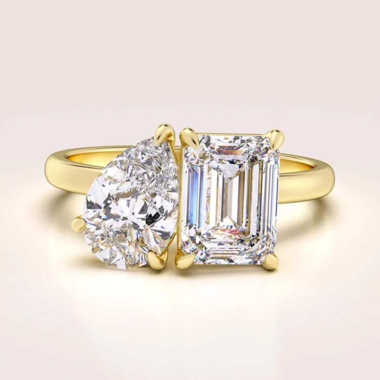 verlobungsring-toi-et-moi-moissanit-3-5ct-emeraldschliff-birnschliff-gelbgold-gemini-hariets.jpg