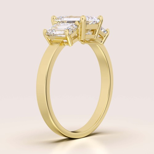 verlobungsring trinity moissanit 3ct smaragdschliff seite gelbgold envy hariets.jpg