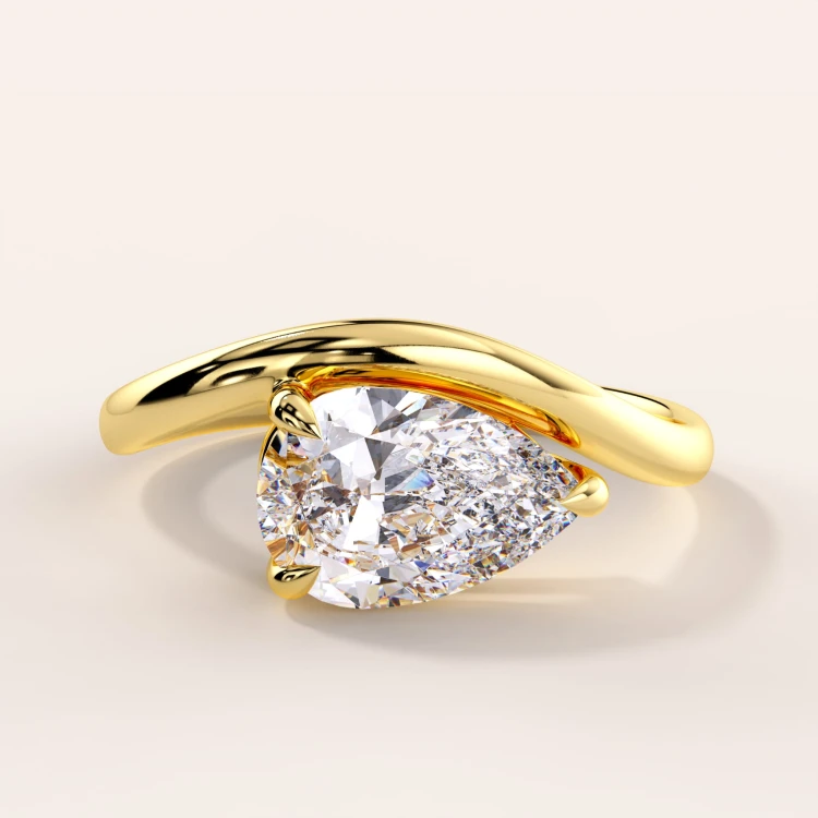 verlobungsring-moissanit-1_5ct-tropfenschliff-gelbgold-icon-hariets.jpg