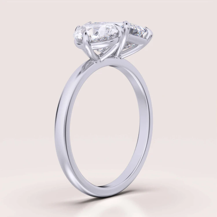 toi-et-moi-verlobungsring-moissanit-3_5ct-smaragd-tropfenschliff-seite-silber-gemini-hariets.jpg
