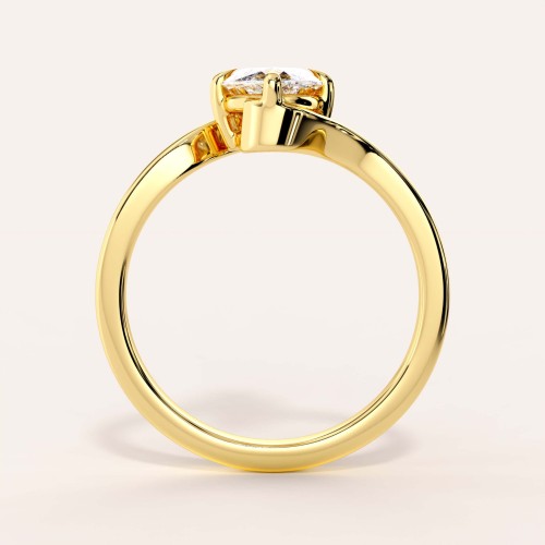 moissanit-ring-2ct-marquise-geschwungene-schiene-front-gelbgold-muse-hariets.jpg