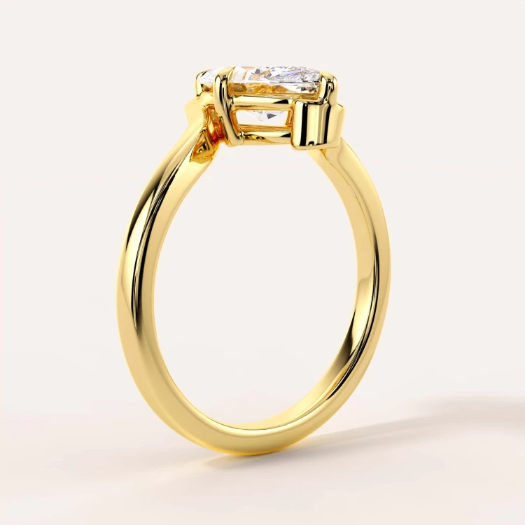 moissanit-ring-2ct-marquise-geschwungene-schiene-seite-gelbgold-muse-hariets.jpg