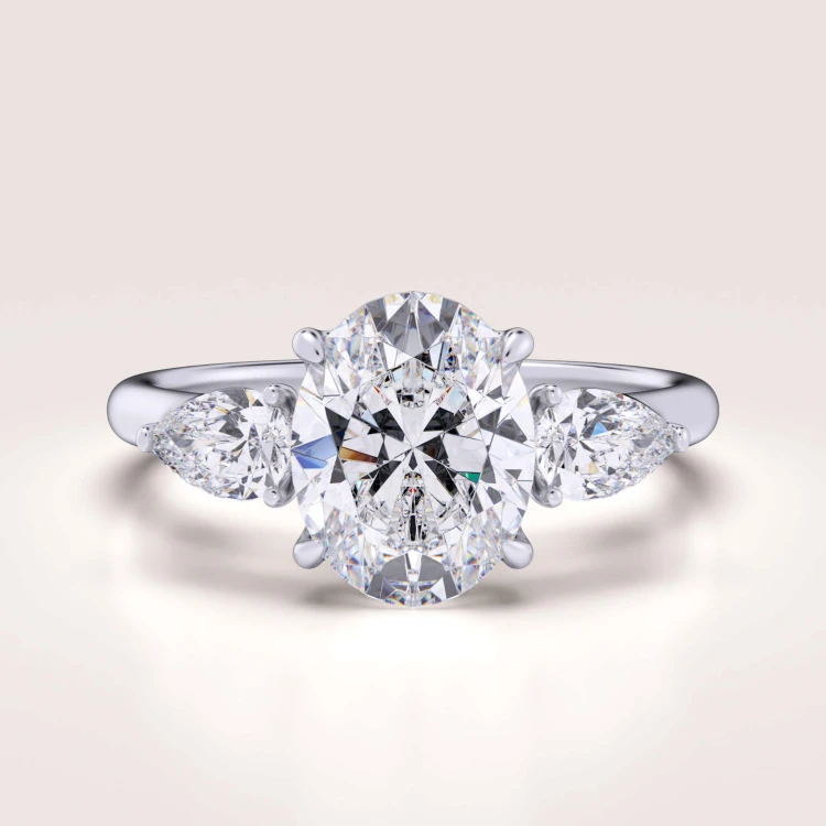 verlobungsring-trinity-seraphina-labordiamant-2ct-zentraler-stein-ovalschliff-weissgold-hariets.jpg