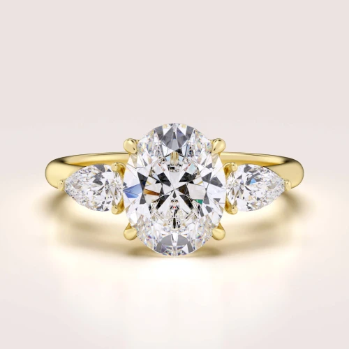 verlobungsring-trinity-seraphina-moissanit-2ct-zentraler-stein-ovalschliff-gelbgold-hariets.jpg